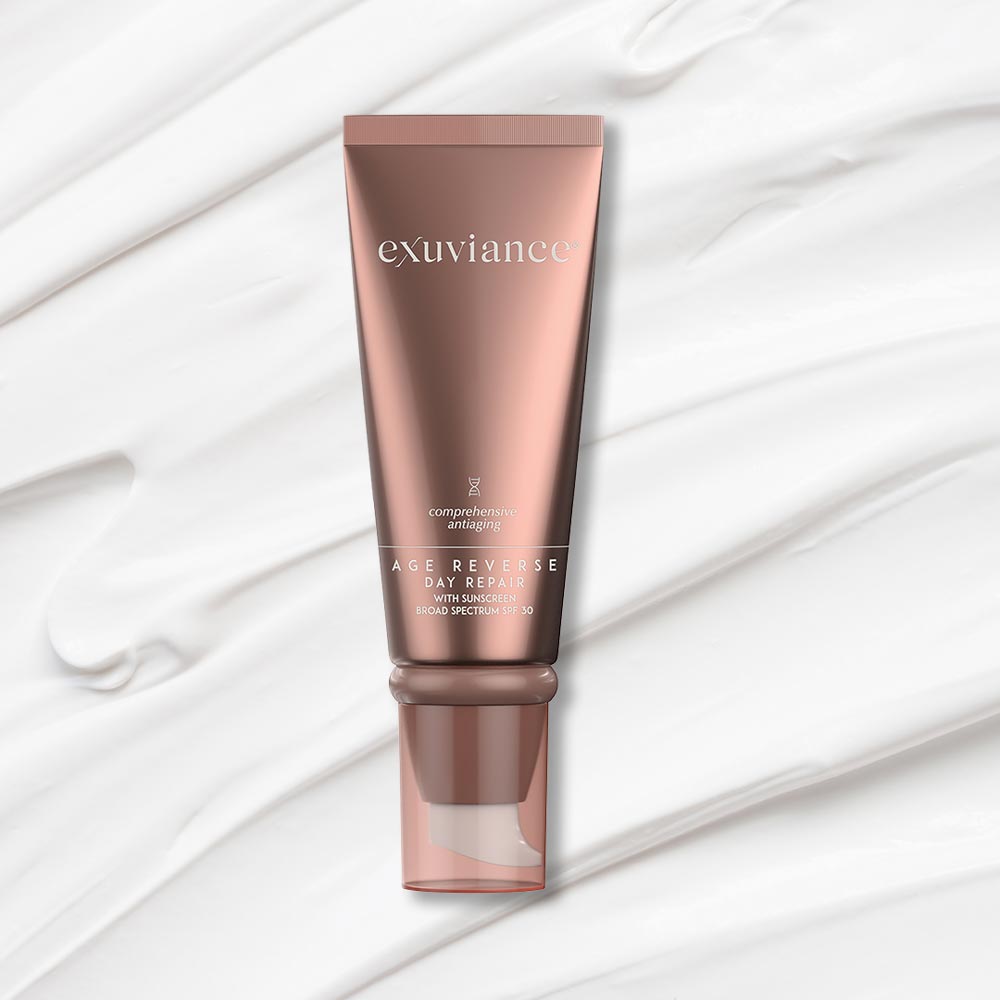 Exuviance AGE REVERSE SPF 30 cream with Retinol, peptides, and antioxidants for anti-aging and sun protection.