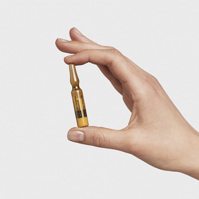 MartiDerm Skin Complex Advanced ampoule held in hand for application