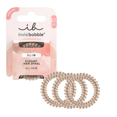 SLIM – Bronze Me Pretty: Slim bronze-colored Invisibobble® hair ring with an elegant, sleek design, displayed in recyclable packaging.