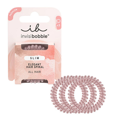 SLIM – Pink Monocle: Slim pink Invisibobble® hair ring with a stylish, delicate look, shown in 100% recyclable packaging.